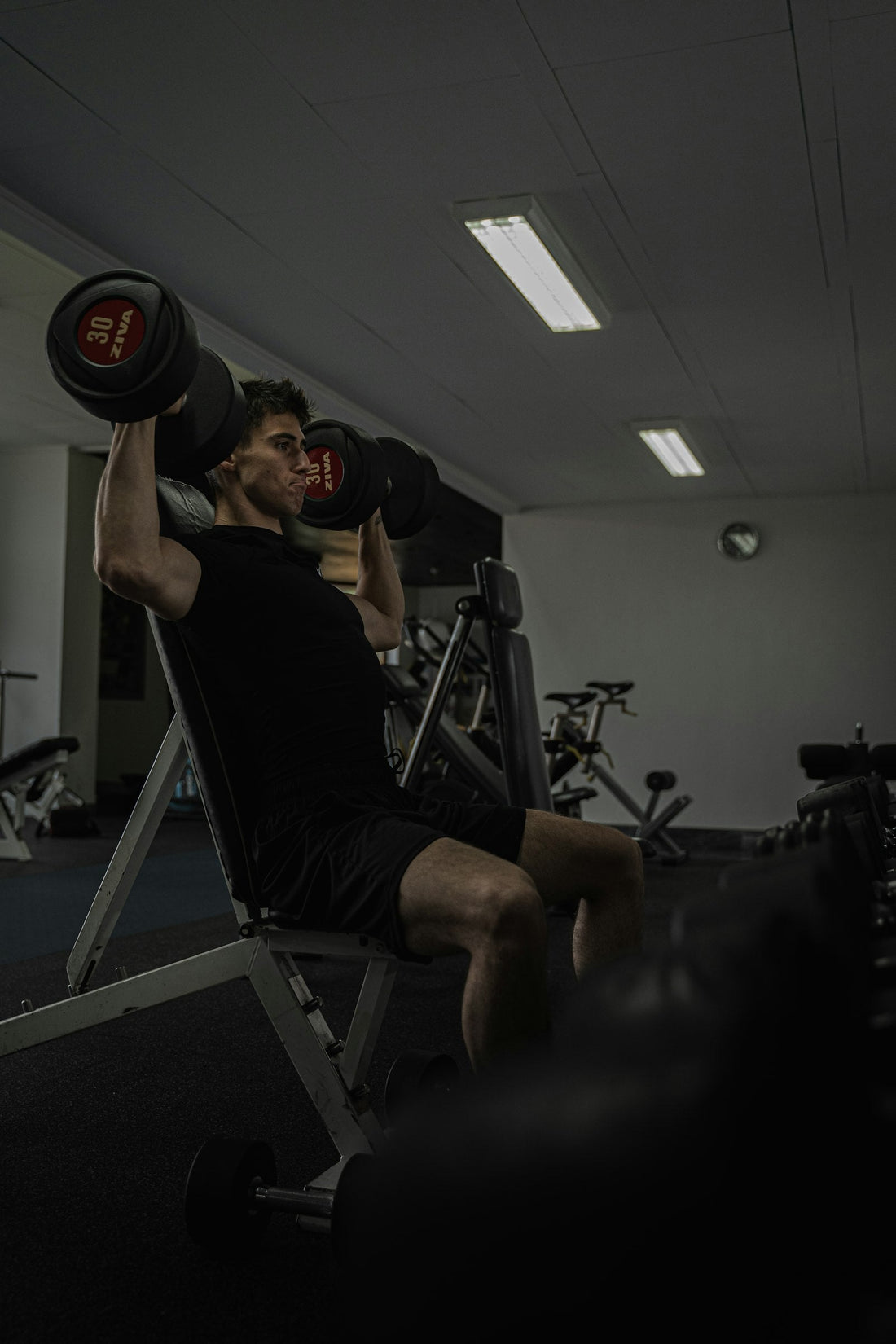 Man lifting weights in the gym