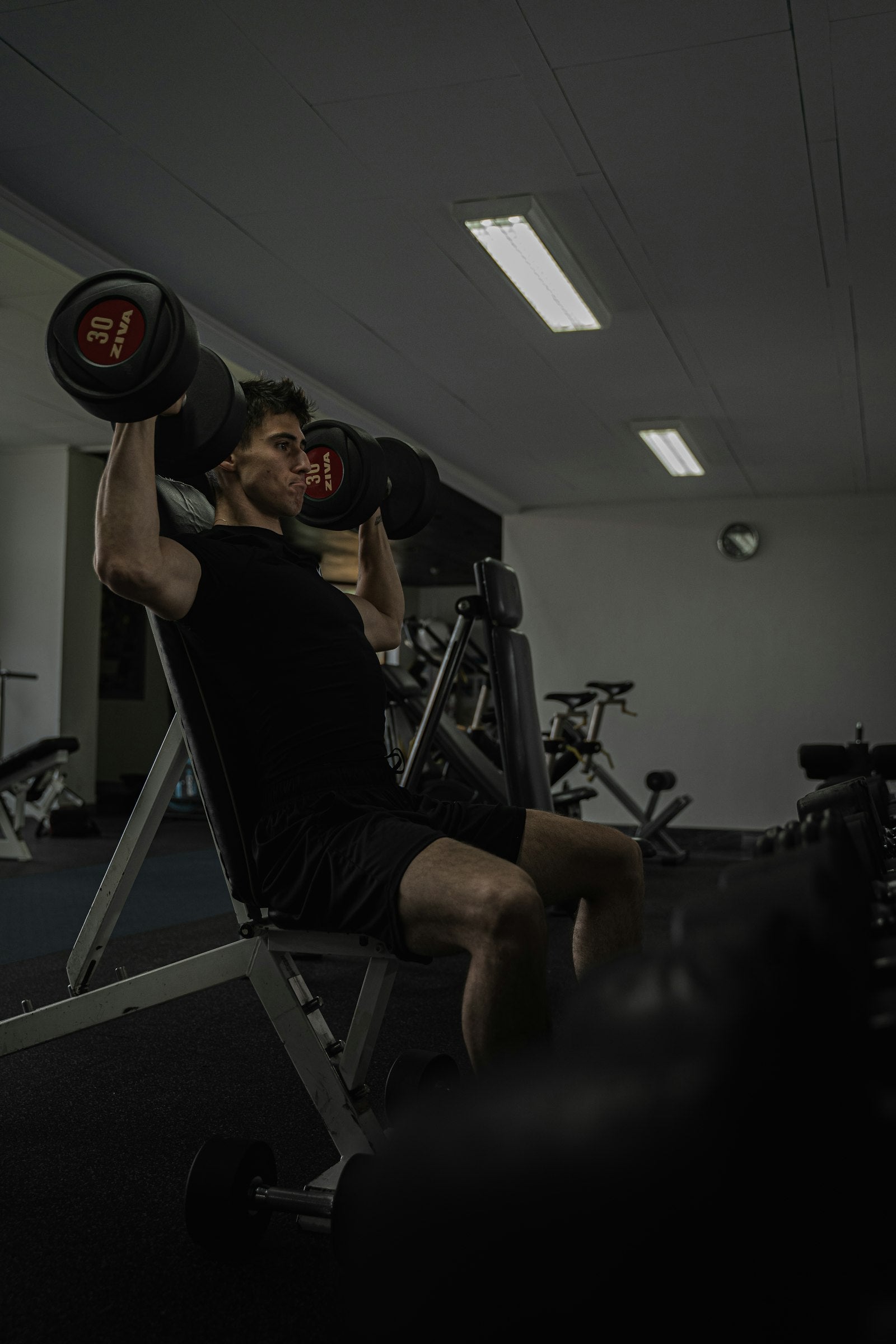 Man lifting weights in the gym